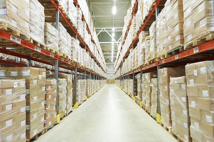 Interior of warehouse. Rows of shelves with boxes