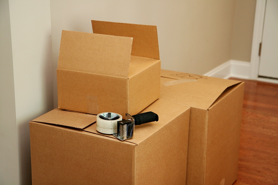 moving boxes stacked in a home with packing materials